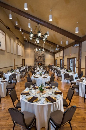 Large room with dining tables and chairs.